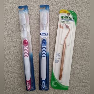 2 Oral-B toothbrushes and 1 gum stimulator
